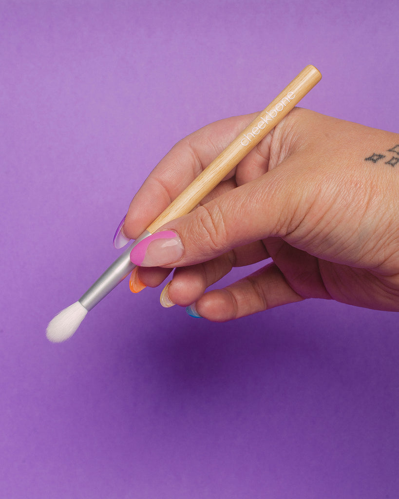 Small Tapered Blending Eyeshadow Brush in a hand
